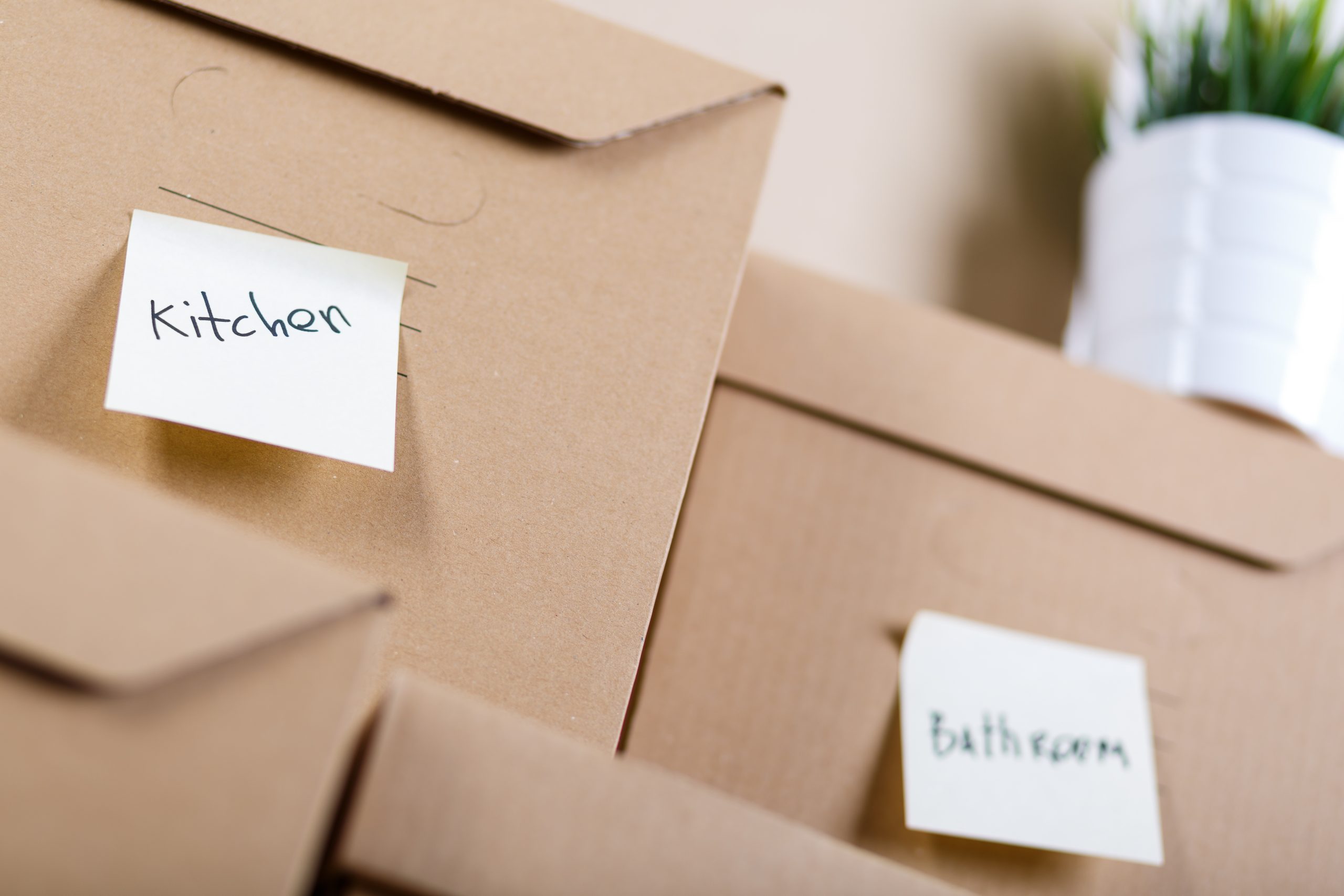 Pile of brown cardboard boxes with house or office goods